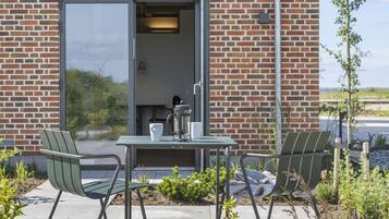 Deluxe-lejlighed - udsigt til have | Terrasse/gårdhave