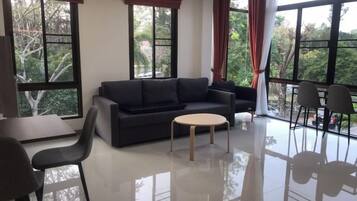 Junior Suite | Living area | 32-inch flat-screen TV with cable channels