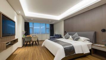 Premier Studio | Living area | 50-inch LCD TV with cable channels, table tennis, books