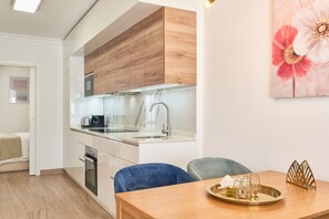 Deluxe Apartment, City View | Private kitchen | Full-size fridge, electric kettle, toaster