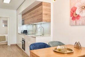 Deluxe Apartment, City View | Private kitchen | Full-size fridge, electric kettle, toaster