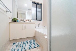 Shower, hair dryer, towels, toilet paper