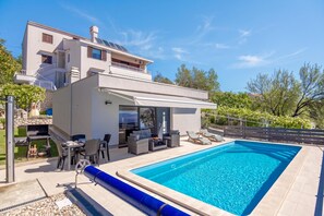 A modern two-story house with a swimming pool, outdoor seating, and a barbecue area. - Holiday Home Sole (Kostrena)