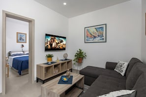 Family House, Multiple Bedrooms, Mountainside (Holiday Home Sole) | Living area | Flat-screen TV