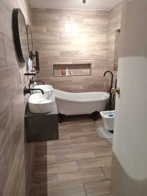 Shower, towels, soap, toilet paper