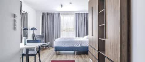 Desk, laptop workspace, blackout drapes, soundproofing