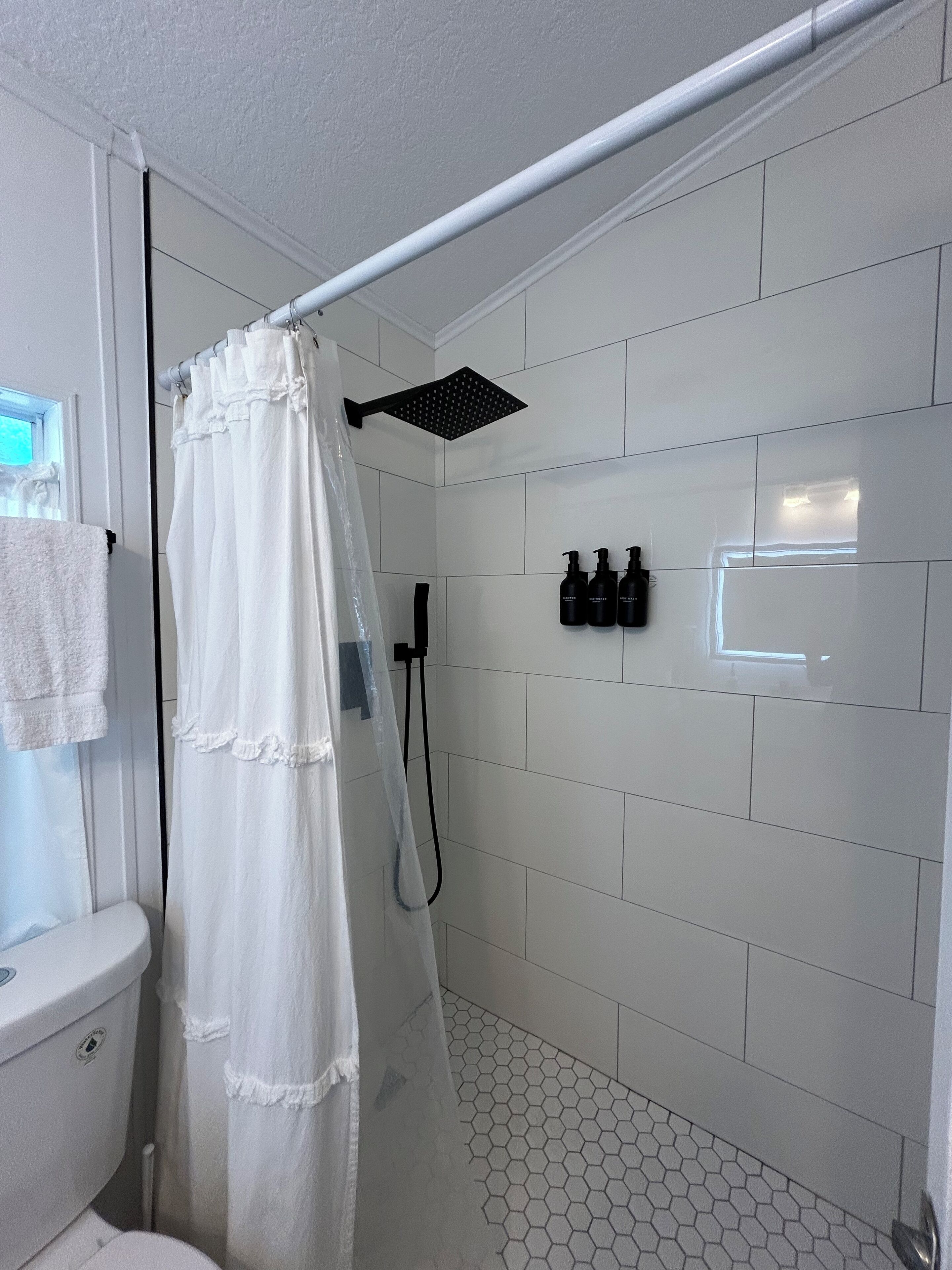 Shower, hair dryer, towels, soap