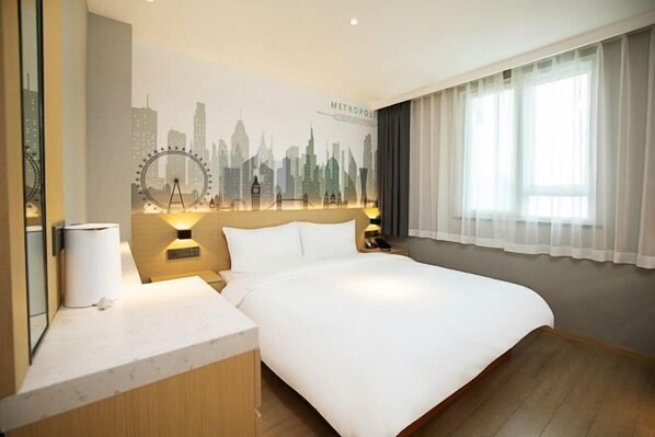 A hotel room with a bed, a nightstand, a lamp, a mirror, a window with curtains, and a city skyline mural on the wall. - Songguo Hotel (Wenhua Road) (Zhengzhou)