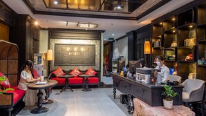 A hotel lobby with a reception desk, seating area, and a large wall with a sign reading "22LANO RESIDENCE HOTEL". - 22land 52 Ngo Huyen Hotel & Spa (Hanoi)