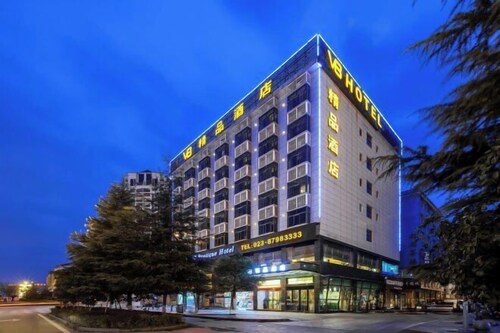 Xiushan V8 Boutique Hotel (Xiushan Railway Station Branch)