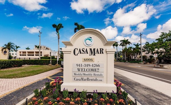 A sign for Casa Mar with contact information and a welcome message. - Casa mar - 10 Premium (Siesta Key)