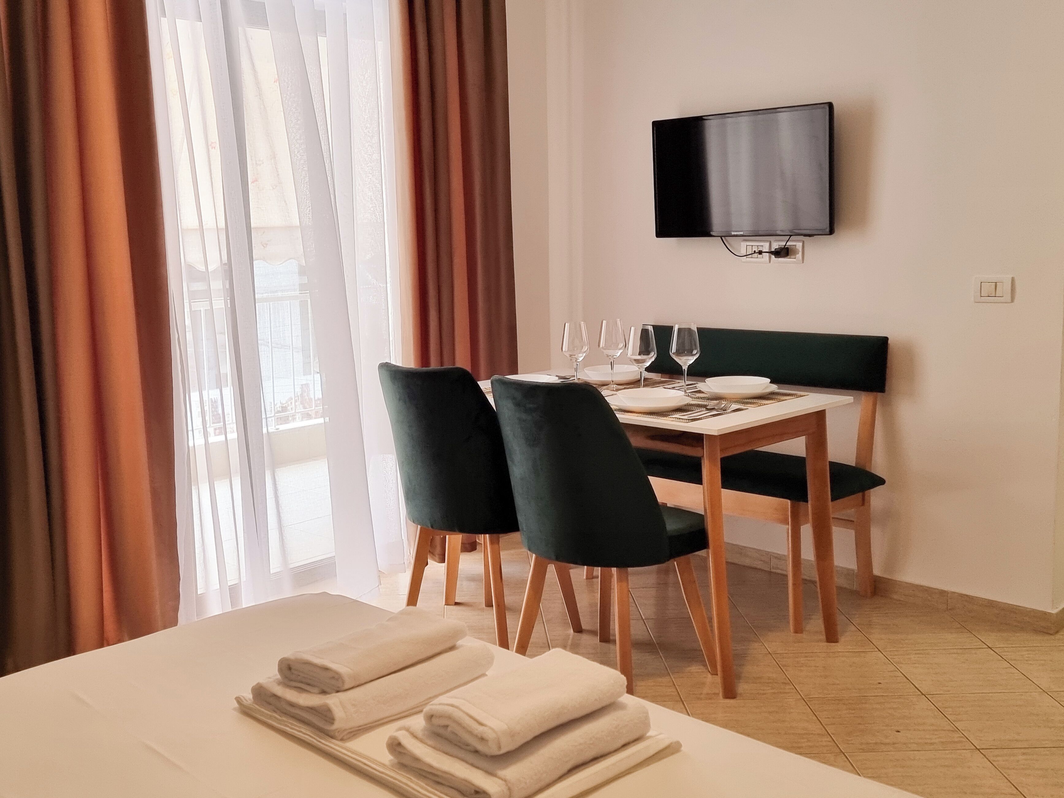 Deluxe Studio | Living area | TV