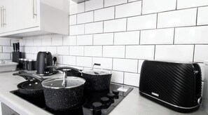 Fridge, oven, cookware/dishes/utensils