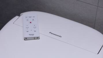 A white Panasonic device on a white surface with the brand name visible.