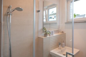 Shower, hair dryer, towels, soap