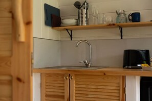 Microwave, toaster, cookware/dishes/utensils, dining tables