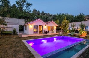 Enjoy a patio area and swim in the pool at this residential property.