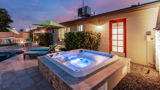 A backyard with a hot tub, outdoor seating, and a pool. - Palm Tree Paradise Heated spa Pool Firepit (Glendale)