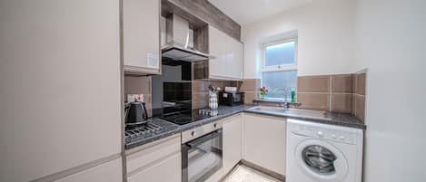 Luxury Apartment, Private Bathroom (One Bedroom) | Shared kitchen | Full-size fridge, microwave, oven, stovetop