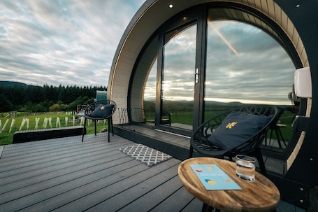 Terrace/patio. Luxury glamping pods with stunning views of the Scottish Highlands.