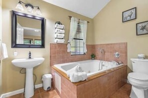 Shower, jetted bath, towels