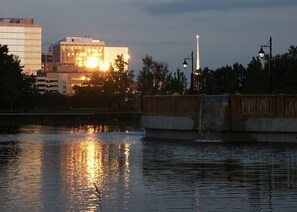 A bridge over a body of water with a cityscape in the background. - The Penthouse at Park Place King bed Fast Wifi and Free Coffee (Wilmington)
