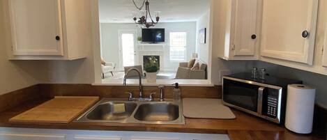 Microwave, stovetop, dishwasher, cookware/dishes/utensils