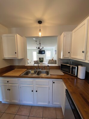 Microwave, stovetop, dishwasher, cookware/dishes/utensils