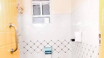 Shower, hair dryer, towels, shampoo