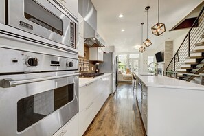 Microwave, oven, stovetop, dishwasher - Modern Ballpark 2-bedroom townhome with private roof deck and attached garage (Denver)