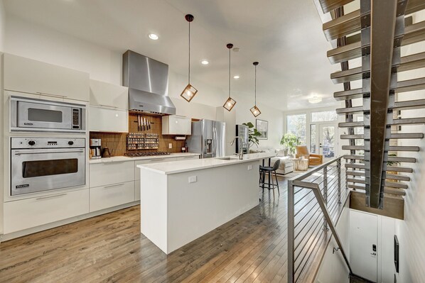 Microwave, oven, stovetop, dishwasher - Modern Ballpark 2-bedroom townhome with private roof deck and attached garage (Denver)