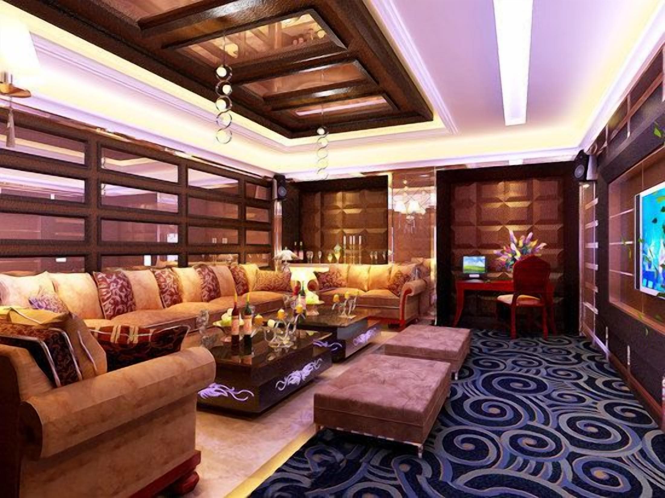 Un moderno vestíbulo de hotel con un sofá modular, una mesita de centro y una alfombra estampada.