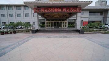 A building with a large entrance and a sign above it.