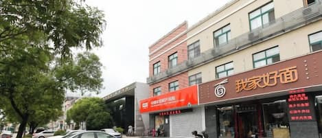 A building with a storefront and a closed shop.