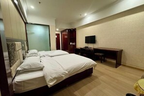 A hotel room with a large bed, a desk, a chair, and a television. - Super 8 Hotel (Qitai Tuanjie South Road Branch) (Qitai)