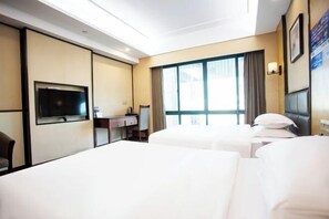 A hotel room with two beds, a desk, a TV, and large windows. - Changxing Penglaiju Boutique Hotel (Changxing)