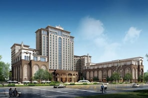 A large hotel with multiple floors, a central courtyard, and a prominent entrance. - Jiahua Hotel (Puning)
