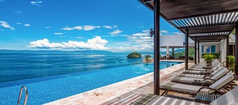 Luxurious 6th-floor condo with pool, oceanfront balcony & water view