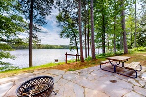 Outdoor dining - Picturesque Log Home with dock, fire pit,  pool table, & WIFI (St. Germain)