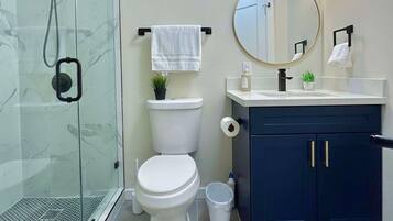 Shower, hair dryer, towels, soap