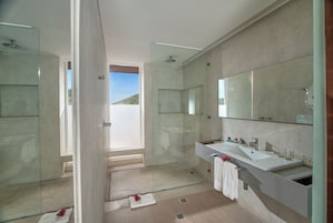 Junior Suite, Partial Sea View | Bathroom | Shower, hair dryer, slippers, towels
