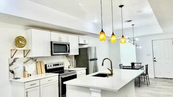 Coffee/tea maker, fridge, microwave, oven
