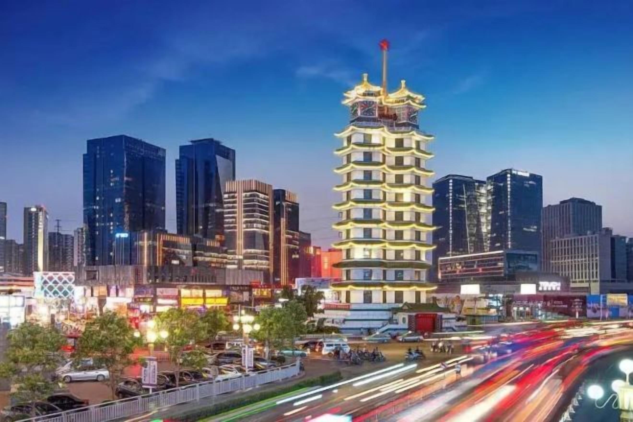 A multi-story building with a distinctive pagoda-style roof, surrounded by modern high-rise buildings.