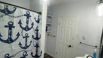 Shower, towels, soap, toilet paper