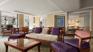 A hotel lobby with a sofa, chairs, a coffee table, and a dining area. - Ocean View-1Bdrm:1Bath -Westin Kaanapali Maui North Villas (Lahaina)