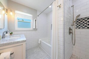 Shower, hair dryer, towels, shampoo
