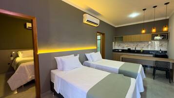 Family Quadruple Room, Pool View | Desk, laptop workspace, free WiFi, bed sheets