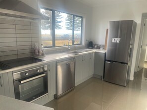 Fridge, microwave, oven, stovetop - Ocean views in large family home (Napier)