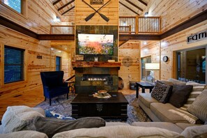 スマートテレビ、暖炉、テーブルサッカー台、書庫