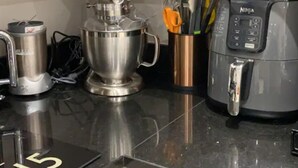 A kitchen counter with a mixer, a coffee maker, and a rice cooker. - Luxury Central Hale  living (Altrincham)